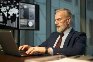 Businessman Working on Laptop in Finance Department