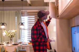 Man checking a cabinet.