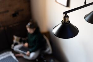 Teenager girl with laptop in apartment