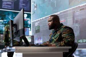 Military expert in an advanced operations center oversees satellite intelligence.
